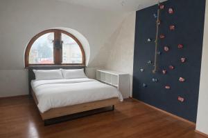 a bedroom with a bed and a climbing wall at MOARI pokoje gościnne in Szczyrk +127 photos