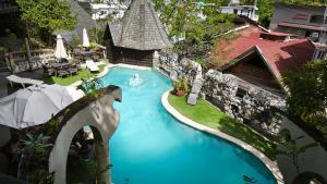 an overhead view of a swimming pool in a resort at Hotel Tropicana Castle Sabang Mindoro in Sabang