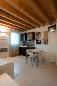 a kitchen and dining room with a table and chairs at Ca' del Sile in Morgano +54 photos