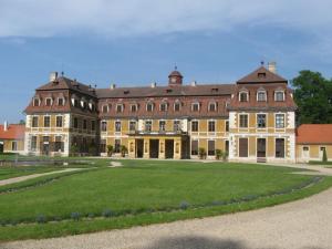 a large building with a large lawn in front of it at Apartmán Eva in Crhov