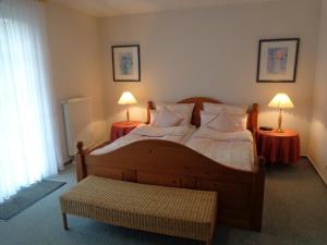 Postel nebo postele na pokoji v ubytování Haus Utspann
