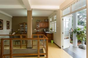 a kitchen with wooden countertops and a large window at Vista House Kandy in Kandy
