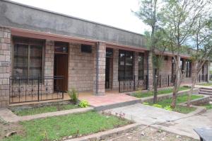 a brick building with windows on the side of it at Selam Guest House in Lalibela