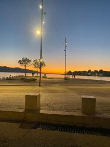 a street light sitting on the side of a street at Romeo apartament in Sarandë +3 photos