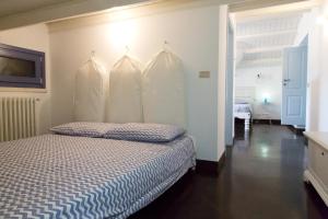 A bed or beds in a room at Villa Tipica Casa Tua
