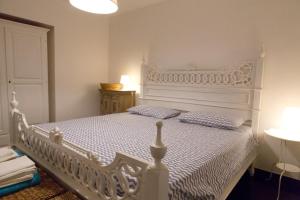 A bed or beds in a room at Villa Tipica Casa Tua