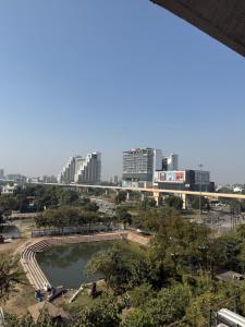 a view of a city with a river and buildings at Luna Stays in Greater Noida