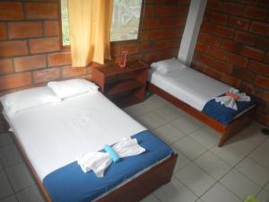 Postel nebo postele na pokoji v ubytování Black Beach House