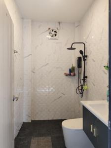 a bathroom with a shower with a toilet and a sink at Koh tao two view in Ko Tao +29 photos