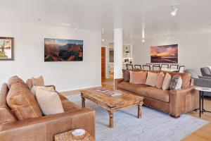 a living room with two couches and a coffee table at Ice House 317 condo in Telluride