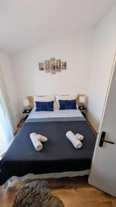 a bedroom with a bed with two pillows on it at Appartameno Calnova in Vodnjan