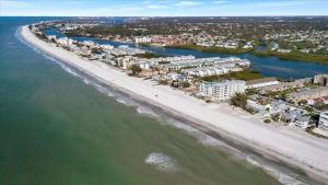 an aerial view of a beach with condos at Beach Access & Heated Pool Resort Condo for 8 in Clearwater Beach