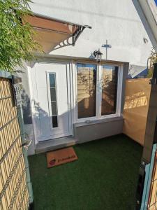 an outside view of a small chapel with a window at Ella1 in Sremska Kamenica +3 photos
