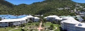 an aerial view of a resort with a mountain at Beau studio vue mer Anse Marcel in Anse Marcel 