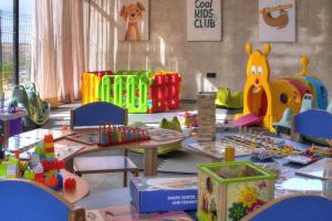 a childrens play area with tables and toys at The Ranch Camp in El Karia