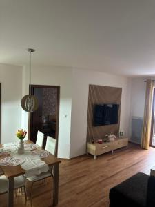 a living room with a table and a dining room at Apartmán Emy in Bystrá +23 photos