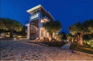 a building with a sign on the side of it at Micabalù Luxury Apartment in Marina di Camerota