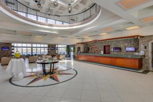 a lobby of a hotel with a table in the middle at Diamond Of Bodrum in Bodrum City +50 photos