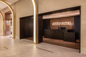 a lobby of a hotel with a modern hotel sign on the window at Nobu Hotel New Orleans - A Caesars Rewards Destination in New Orleans