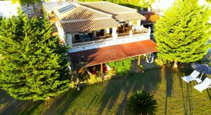 an overhead view of a house with a balcony at Villa Belvedere - Panoramic Sea View apts in Vasilikos +57 photos