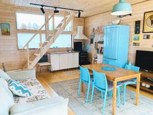a kitchen and living room with a table and chairs at Park & Beach House in Ureki Magnetiti, Sleeps 6 in Ureki
