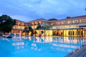 a hotel with a swimming pool in front of a building at Heritance Ahungalla in Ahungalla