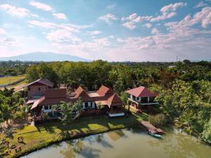 an aerial view of a house with a river at Anusorn Villas & Garden Oasis - Peaceful Chiang Mai Hideaway in Ban Ton Chok