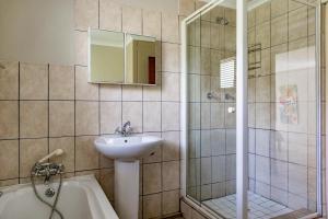 a bathroom with a sink and a shower and a tub at Bona Vista in Pringle Bay +15 photos