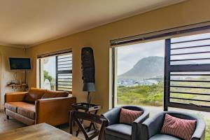 a living room with a view of a mountain at Bona Vista in Pringle Bay