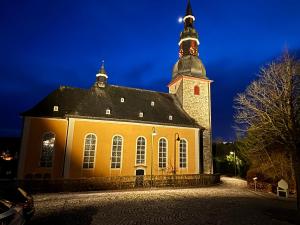 a large church with a tower on top of it at Ferienwohnung Gaber in Reichshof 