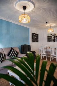 a living room with a couch and a table at El Hierro Bed in Valverde