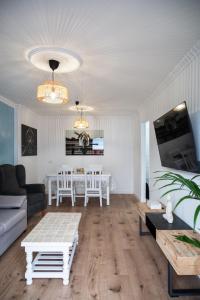 a living room with a couch and a table at El Hierro Bed in Valverde