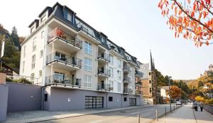 a large white building on the side of a street at Rosaliya in Cochem