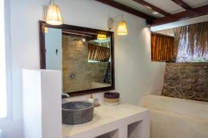 a bathroom with a sink and a mirror at Mondo Surf Village in Canggu +20 photos