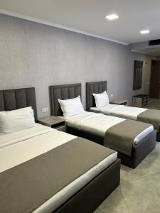 a hotel room with two beds in a room at Aparan Hotel in Aparan