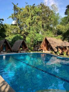a swimming pool in front of a resort at Serenity Cove Resort in San Pablo