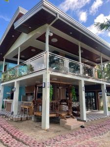 a large building with a balcony on top of it at Gavins Nest in Romblon