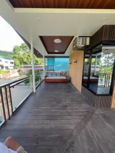 a view from the outside of a house with a balcony at Gavins Nest in Romblon