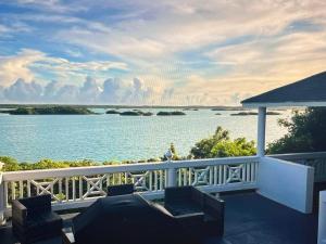 a balcony with a view of a body of water at Escape to paradise in Providenciales