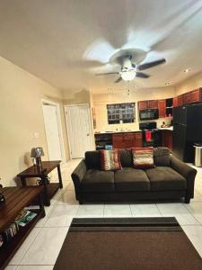 a living room with a couch and a ceiling fan at Escape to paradise in Providenciales