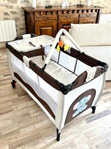 a bed with a mickey bed frame in a room at La Pastourelle en Lozère in Le Bacon