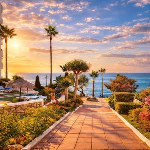 a pathway with palm trees and the ocean in the background at Apartamento Algaida Calahonda in Sitio de Calahonda +37 photos