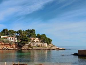 a house on an island in the water at Fabian Appartament in Bagheria