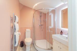 a bathroom with a shower and a toilet and a sink at The Station at Shustoke - Birmingham Airport & NEC in Shustoke +63 photos