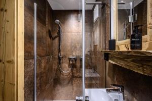a bathroom with a shower and a sink at Ascherhof in Thiersee +61 photos