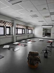 a room with mats and a chair on the floor at Majoitus Fox in Kuopio