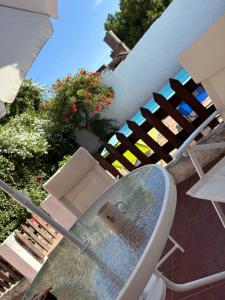 a table and a chair sitting on a patio at Santa Cruz 5761 in Mar del Plata