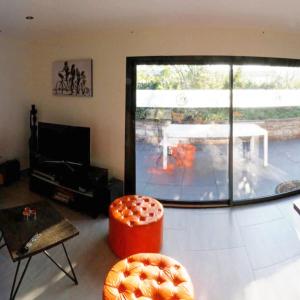 a living room with a view of a patio at Lapin in Lesquin