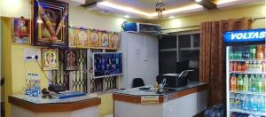 a soda shop with a cash register and a soda machine at JB lodge in Chidambaram +7 photos