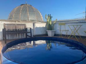 a view of a swimming pool on a roof at Tiny Nest Over Naples, Private Panoramic Terrace in Naples